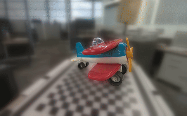 Toy airplane used as the input reference for object mesh reconstruction.